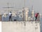 Officials of a building analyze and service television antennas