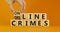 From offline to online crimes. Businessman turns a cube and changes the words `offline crimes` to `online crimes`. Beautiful