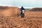 Offroad motorbike driving in dirt.