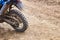 Offroad mountain motorcycle or bike taking part in motocros competition parked on dirty terrain road