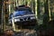 Offroad race on fall nature background. Rallying, competition and four wheel drive concept. Sport utility vehicle or SUV