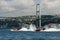 Offshore boats racing under the Bosphorus Bridge in Istanbul, Turkey