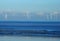 Offshore coastal windfarm in a calm blue sea