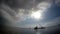 Offshore construction vessel at the vicinity where dolomite sands are dumped on city shore line. silhouette