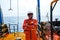 Offshore engineer, standing on the deck of an industrial ship