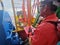 Offshore marine crew operate tugger winch during anchor handling operation at sea