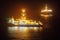 Offshore oil drillship at night