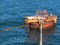 Offshore oil loading from single buoy mooring into oil tanker. Single buoy mooring serves as mooring point for tankers loading and