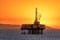 Offshore oil platform at dusk