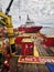 Offshore support vessel loading cargo at port