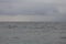 offshore view with cloudy weather conditions, comulus clouds covering the sky