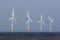 Offshore wind farm turbines on sea horizon. Renewable clean ener