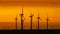 Offshore Wind Turbines with sun just above horizon