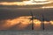 Offshore wind turbines at sunrise. Environmental concern and renewable energy