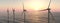 Offshore wind turbines at sunset