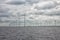 Offshore windfarm near Dutch coast with cloudy sky