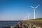 Offshore Windmill farm in the ocean Westermeerwind park , windmills isolated at sea on a beautiful bright day