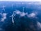 offshore windmill park with clouds and a blue sky, windmill park in the ocean drone aerial view with wind turbine