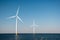 Offshore windmill park green energy in the Netherlands Europe, wind mill turbines at sea and land providing green energy