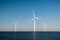 Offshore windmill park green energy in the Netherlands Europe, wind mill turbines at sea and land providing green energy