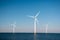 Offshore windmill park green energy in the Netherlands Europe, wind mill turbines at sea and land providing green energy
