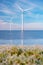 offshore windmill park with stormy clouds and a blue sky, windmill park in the ocean. Netherlands