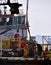 Offshore worker prepared to boarding personal safety basket hanging in the air