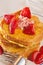 Oganic cornmeal crusted french toast with strawberries