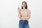 Oh I have idea. Portrait of excited attractive young european woman in pink t-shirt and jeans, raising index finger in