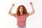 Oh yes, sweet success. Attractive cheerful redhead curly glamour girl striped t-shirt enjoy summer jumping dancing