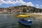 OHRID, MACEDONIA - JUNE 10, 2019: Fishing boat in the background historical part town Ohrid, UNESCO heritage listed, Republic of