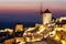 Oia at dusk, with beautiful windmill, Santorini island, Greece