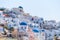 Oia village, Santorini, Greece. Architectural background. View of traditional houses in Santorini. Small narrow streets and roofto