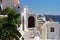 Oia village street on the edge of volcano caldera of Santorini island.