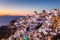 Oia village at sunset, Santorini island, Greece.