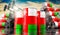 Oil barrels with flag of Oman and oil extraction wells - 3D illustration