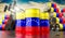 Oil barrels with flag of Venezuela and oil extraction wells - 3D illustration