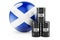 Oil barrels with Scottish flag. Oil production or trade in Scotland concept, 3D rendering