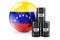 Oil barrels with Venezuelan flag. Oil production or trade in Venezuela concept, 3D rendering