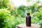 Oil bottle on wood nature background, copy space. Essential oil, natural remedies