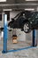 Oil change or engine Promega special automatic device. The car on the lift prepared to repair