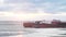 Oil chemical tanker under cargo operations on typical shore station. Video. Cargo tanker on the shore