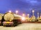 Oil container truck and beautiful lighting of oil refinery plant