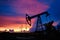 Oil derricks on a background of beautiful sunset