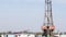 Oil drilling rig and workers