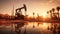 Oil field, oil pumps work in the evening. Oil pump and beautiful sunset reflected in the water, silhouette of a beam pumping plant