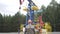 Oil field technical worker standing in front of crude oil pump unit. Engineer overseeing industrial oil pump jack. Oil