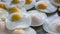 Oil-free fried eggs are lined up on an aluminum tray