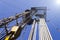 Oil and Gas Drilling Rig onshore dessert with dramatic cloudscape. Oil drilling rig operation on the oil platform in oil and gas