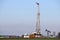 Oil and gas drilling rig and pump jack in oilfield